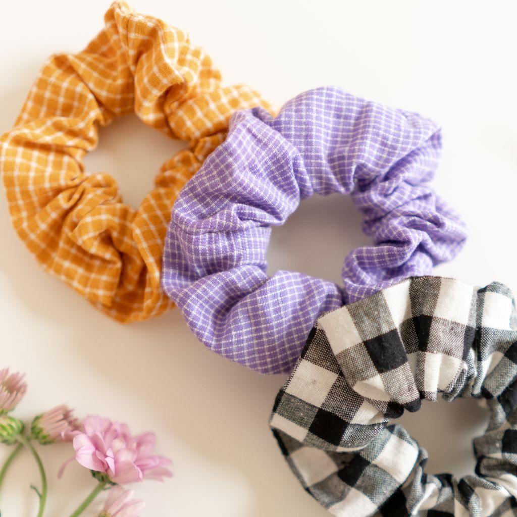 Woman's hair tied with artisan yellow scrunchie
