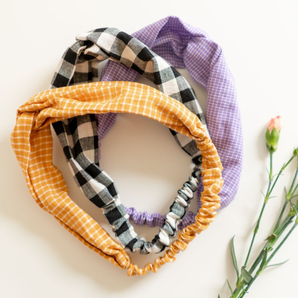 Blue eyed woman with handmade black and white gingham hairband